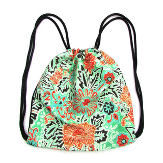 Garden Drawstring Backpack in green, orange white, and black floral pattern with black straps