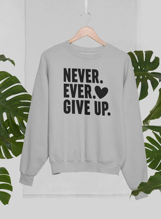 Heather Grey long sleeved sweatshirt with black lettering that says Never Ever Give up. with a black heart. 